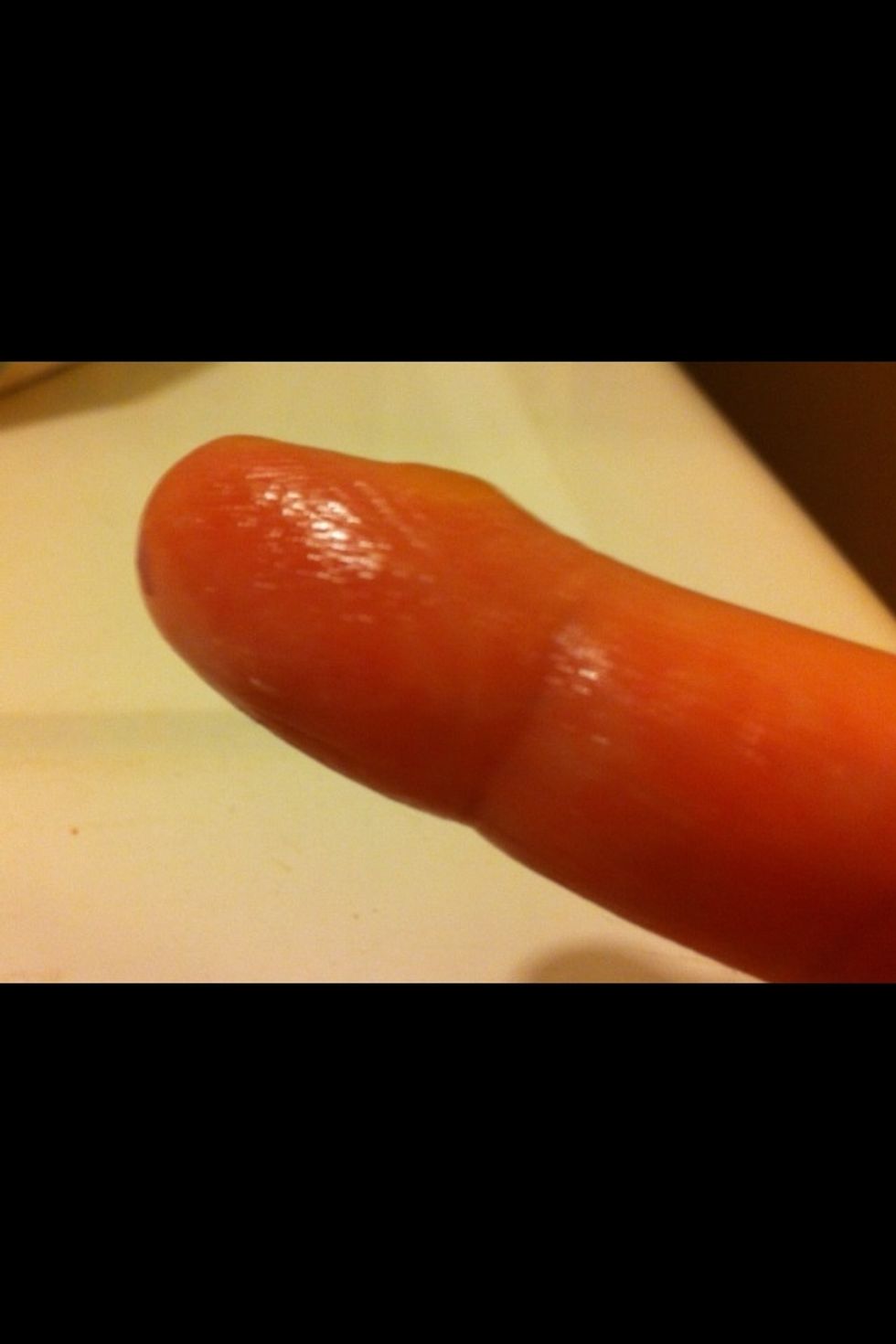 Rub finger over Vaseline (petroleum jelly). See on the finger is a very small amount.
