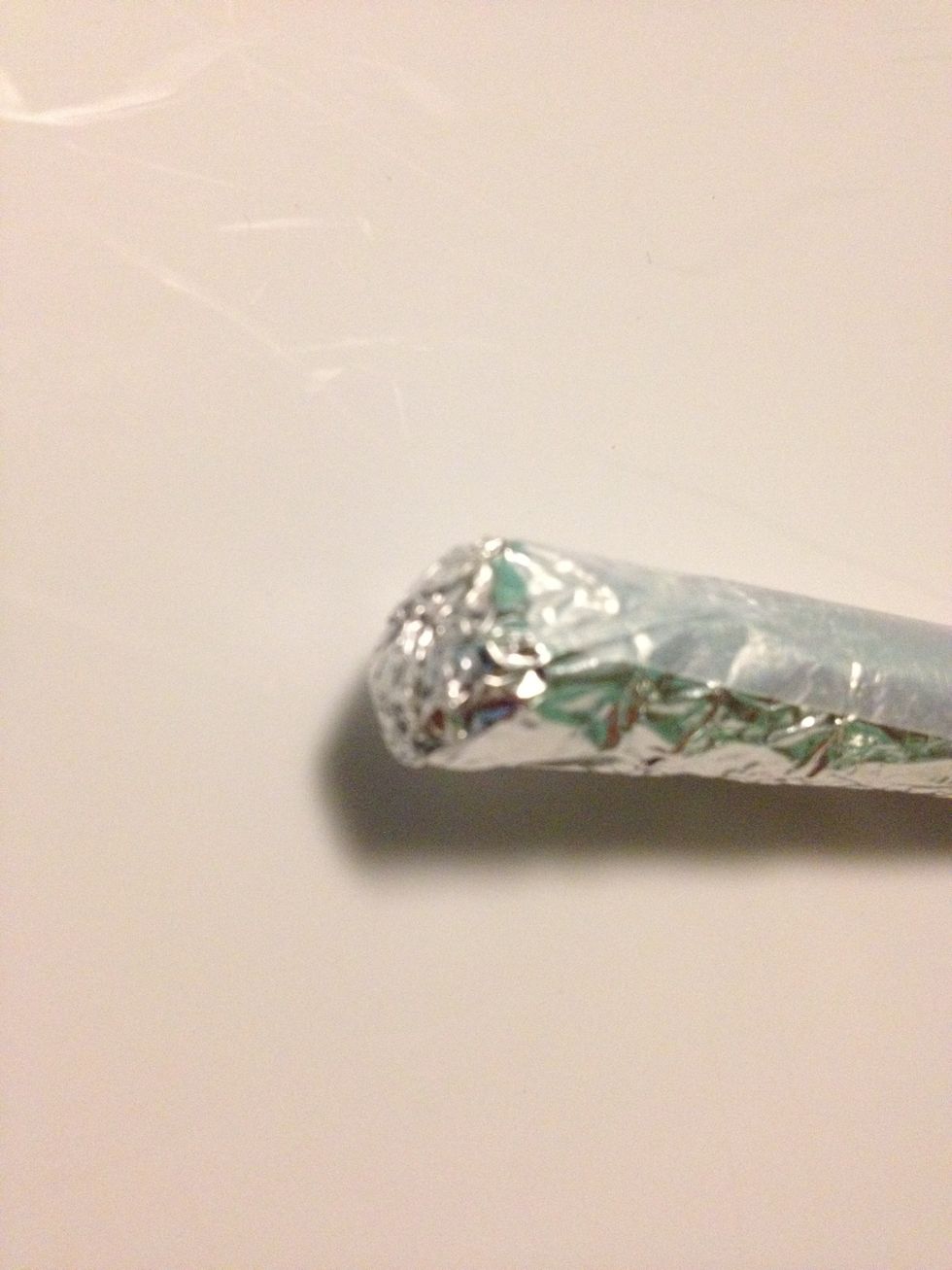 Rub it against a hard surface to smooth the foil out (you may need to snip more foil off the end) and then flatten by pressing down to get at least a 1/4 inch contact surface