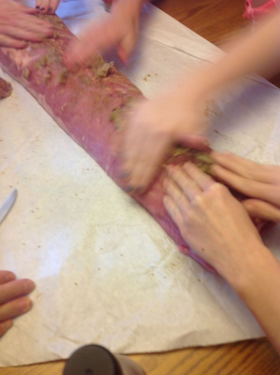 Rub on garlic paste, try to push some into the knife holes