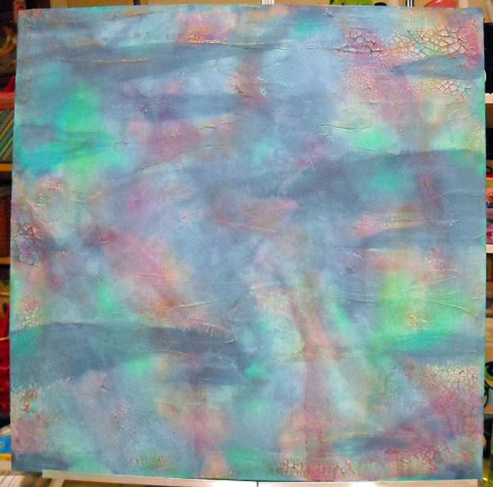 Rub-on paints over some of the largest texture spots helps emphasize the crackle.