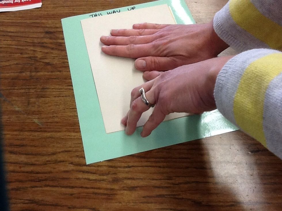 Rub the back of your paper to transfer the paint to your paper.