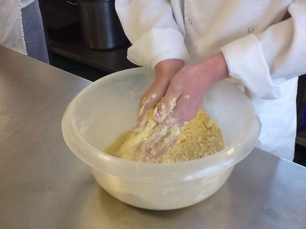 Rub the butter with the flour and sugar until it becomes breadcrumbs.