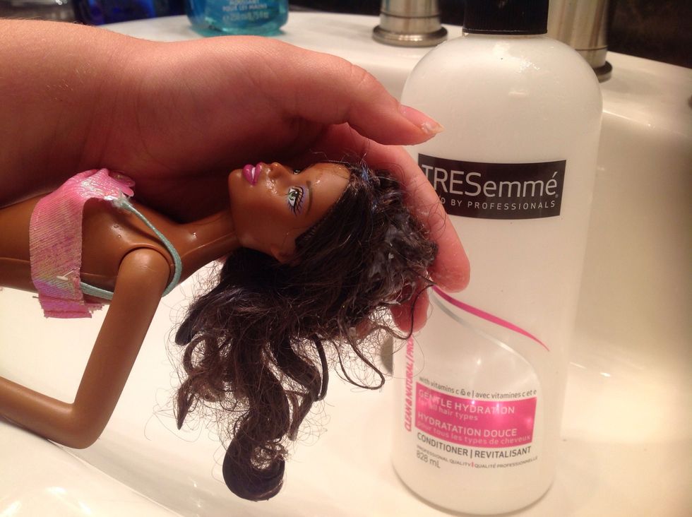 Rub the conditioner in the hair.