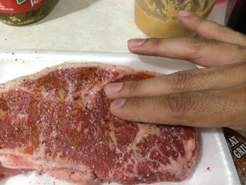 Rub the salt and pepper with the olive oil.