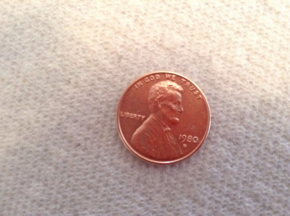 Rub the second mixture off then rinse and dry the penny, and it should look shiny and new!