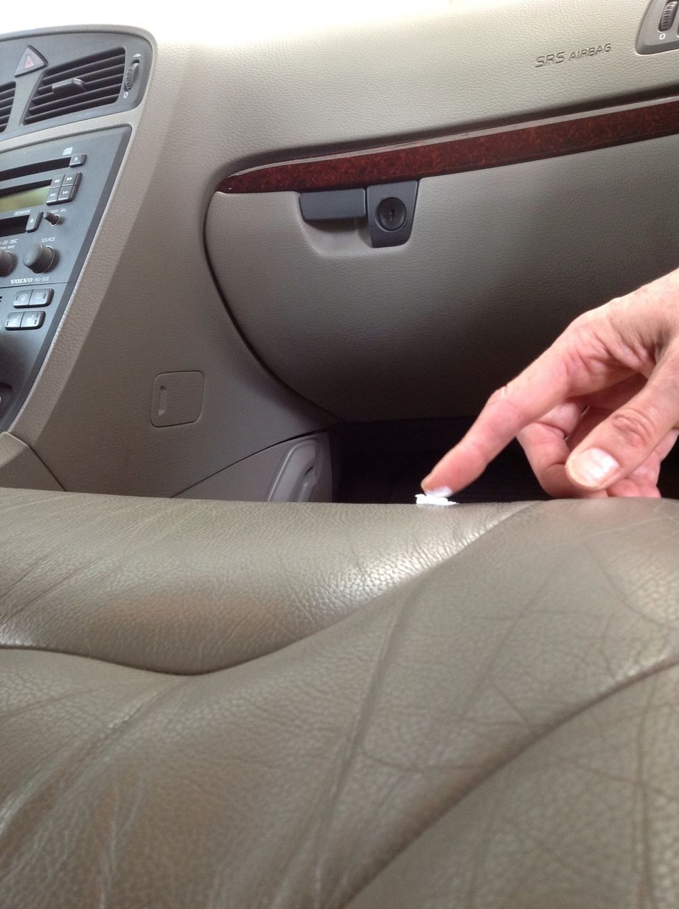 Rub toothpaste into leather. Apply pressure to allow toothpaste to enter recessed cracks in the leather.