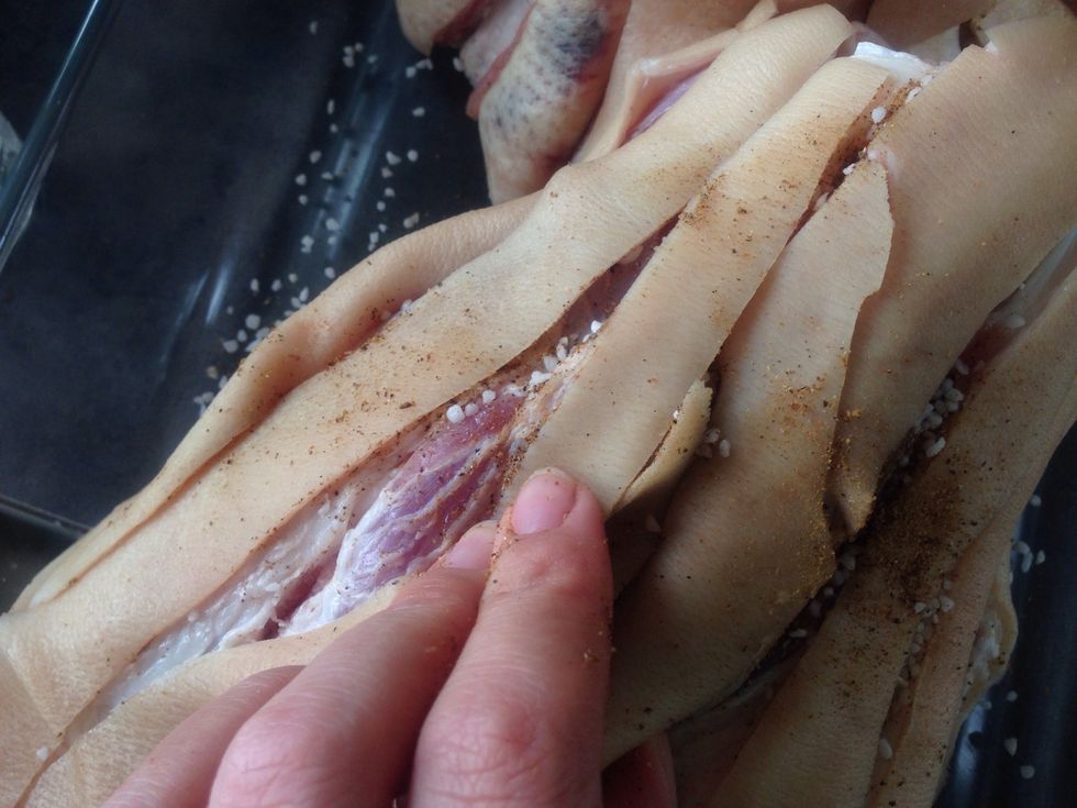 Rub your mixed spices into the cracks in the skin. Make sure to get the salt in all the cracks as it's what makes the pork rinds crackling.