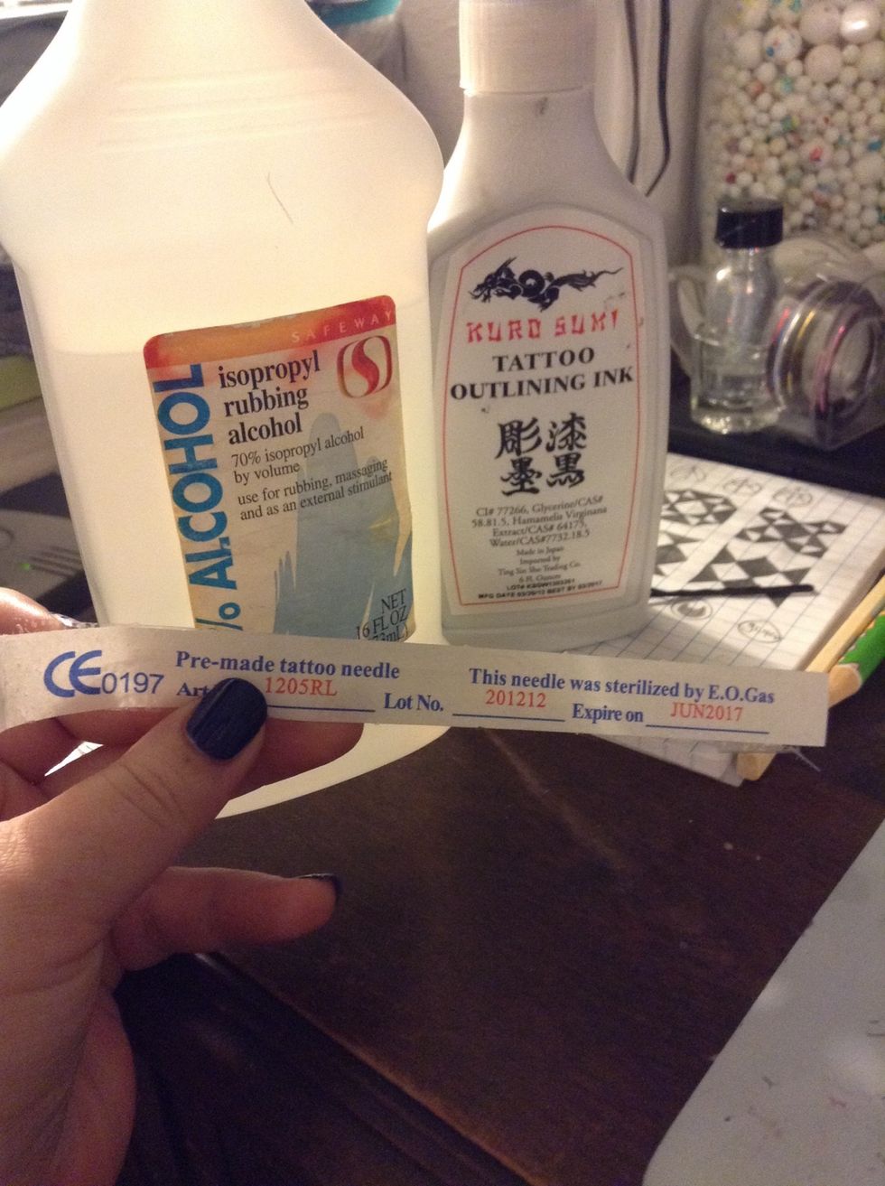 Rubbing alcohol, and I bought tattoo ink on amazon. You need India ink, non-toxic, do NOT use pen ink, because that's how you get ink poisoning. And I got these sterilized tattoo needles off amazon.