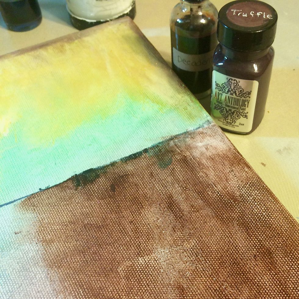 Rubbing that mixture onto the canvas.  And when I say rubbing, I mean rubbing in with my fingers.