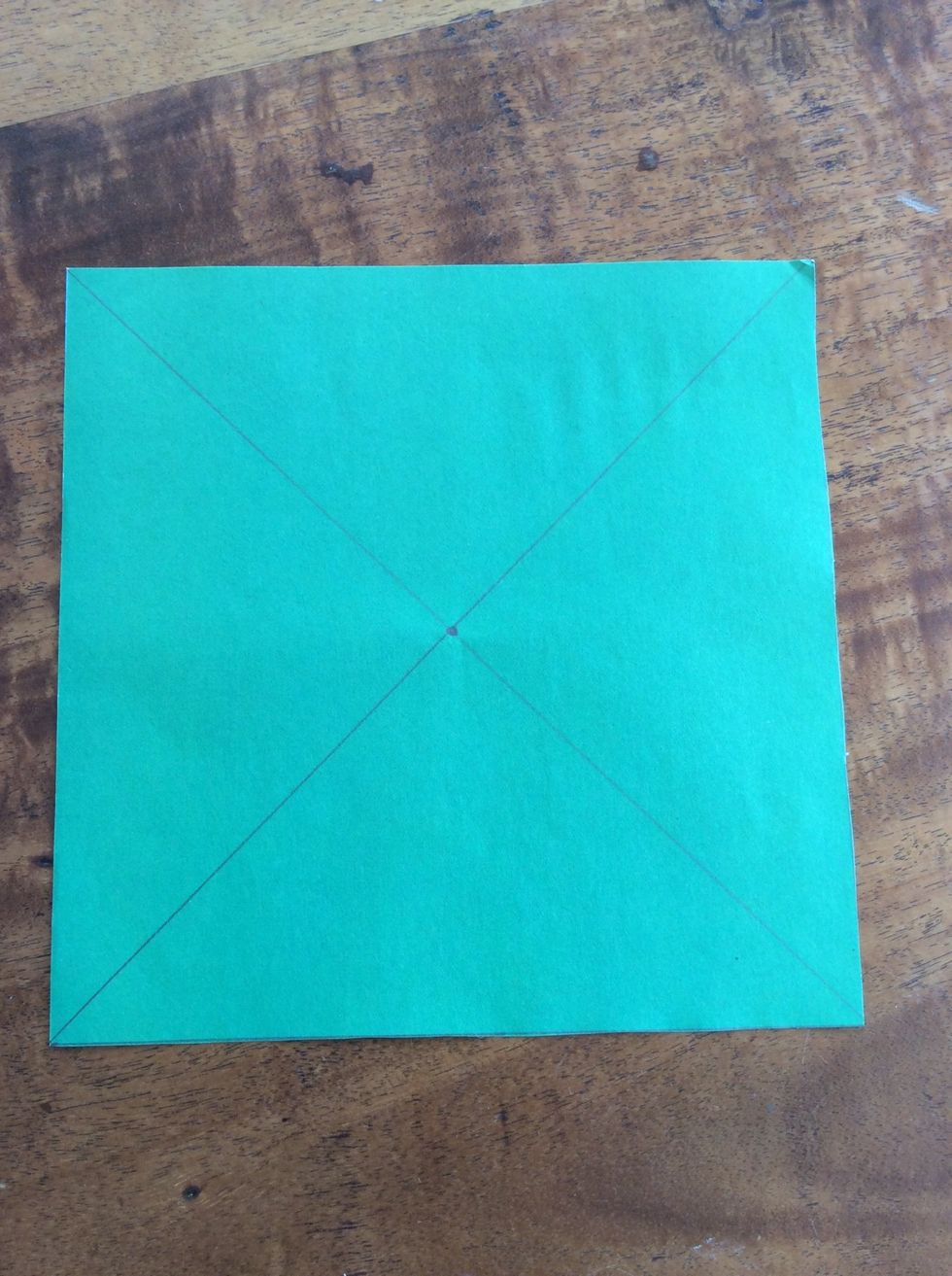Rule a better cross in the middle of he page and mark where the middle is