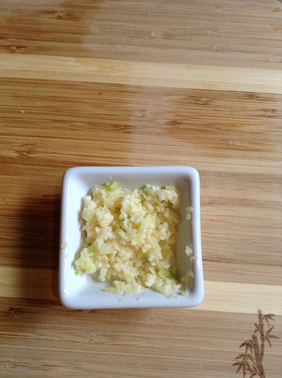 Run 3 garlic cloves through garlic press and set aside.