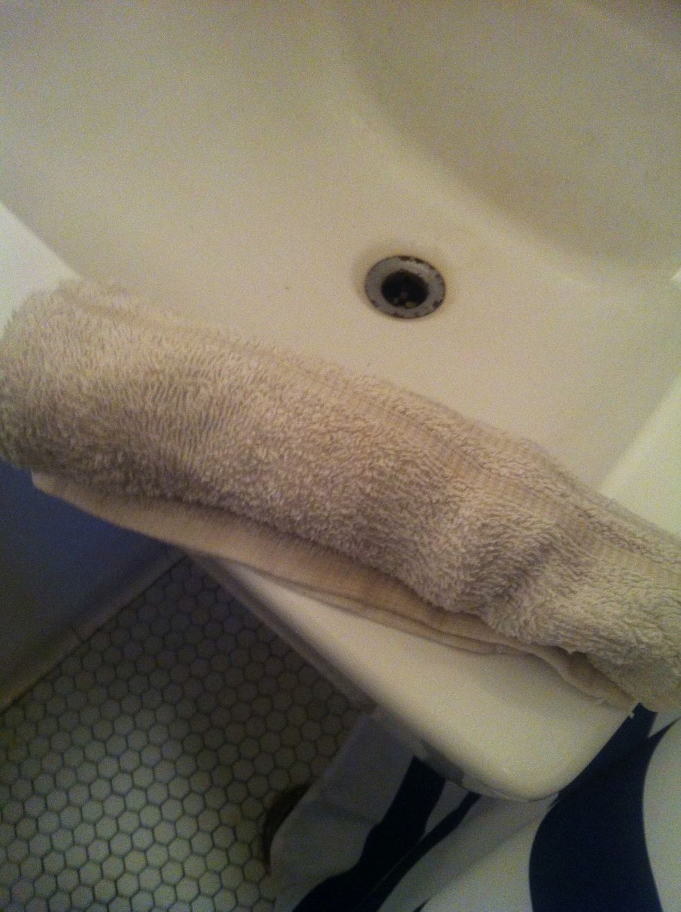 Run a folded hand towel under warm water. Depending on how clean your microwave is, nuke the towel for 25 seconds but remember the towel will be much warmer in the middle than the outsides.