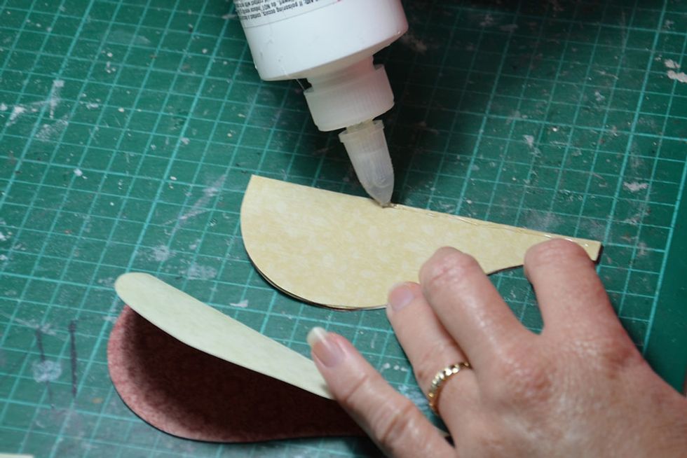 Run some glue down the folded edge only.