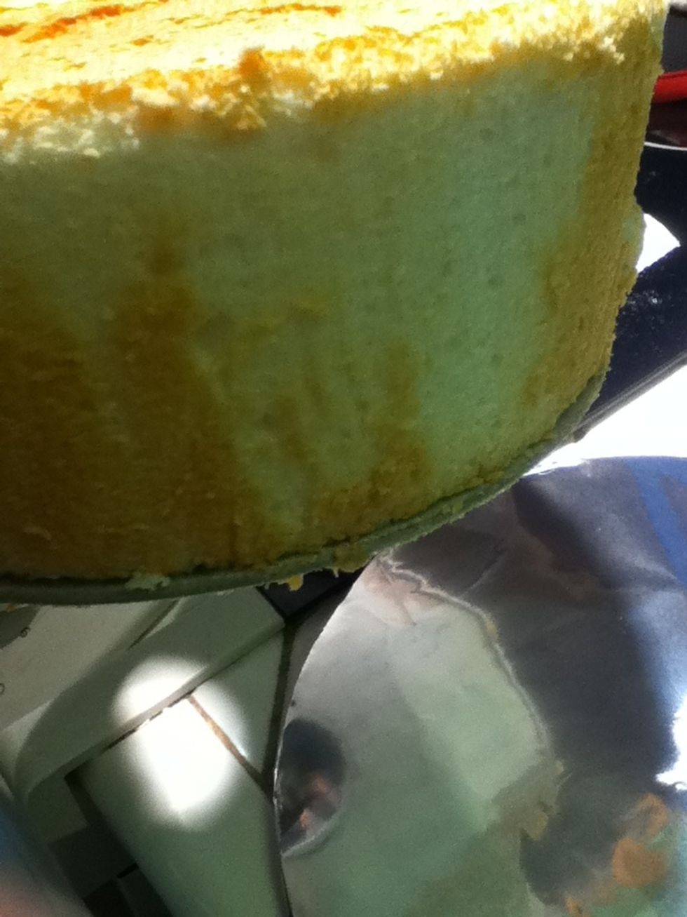 Run the knife around the bottom edge to loosen it further.