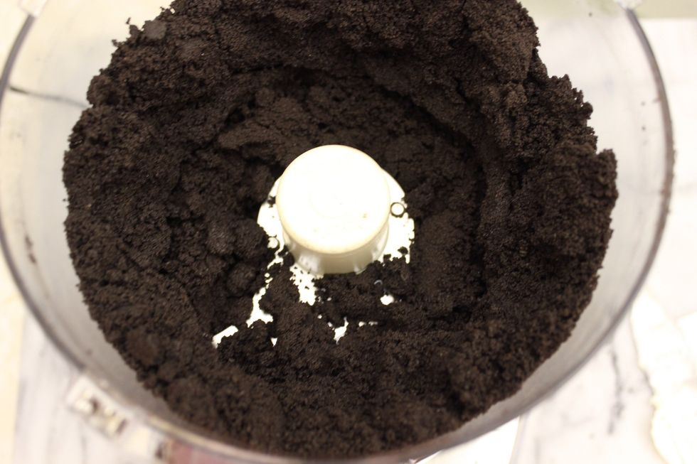 Run the machine until cookies are broken into very fine crumbs. The finer you crumb the cookies, the smoother your cake balls will end up in the end. Chunky crumbs will result in lumpy cake balls.