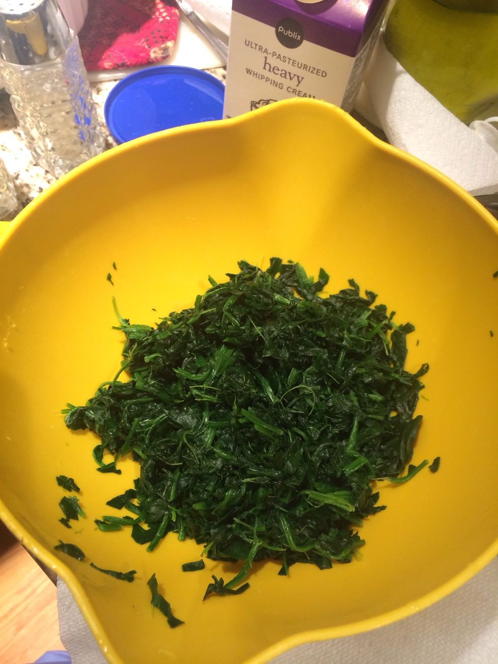 Run the spinach under hot water to defrost