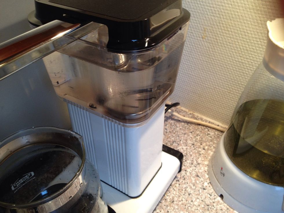 Run water through your coffee machine a couple of times to get all the vinegar out.