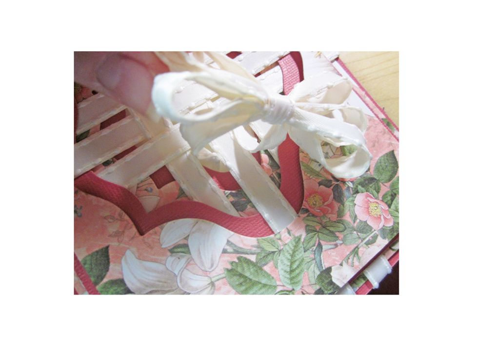 Run your bow tails through the middle of the card.