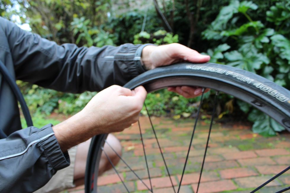 Run your finger around the inside of the tire to remove any grit or stones that might flatten your next tube. Look at the tube itself to see if you can tell what caused the problem.