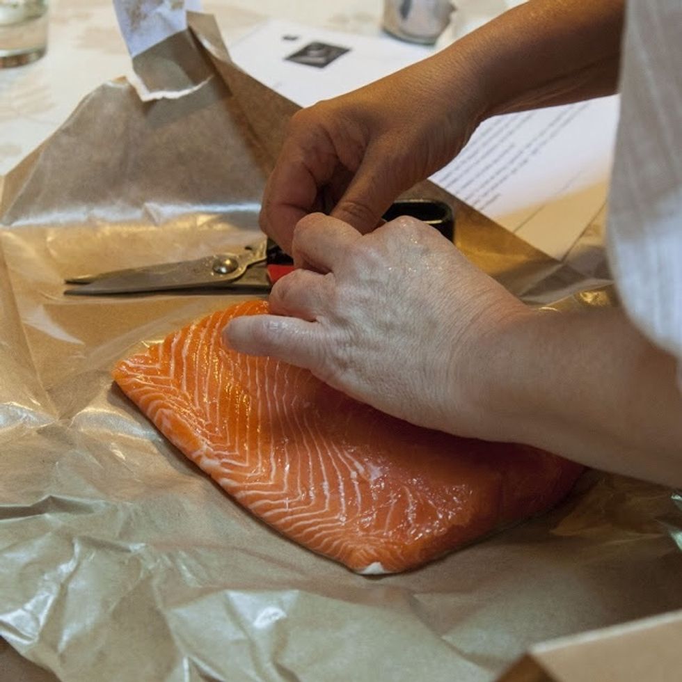 Run your hands over the fish and feel for tiny bones. These are the pin bones. When ever I clean fish, even if they've come to me already cleaned I go over them with a fine pair of boning tweezers.