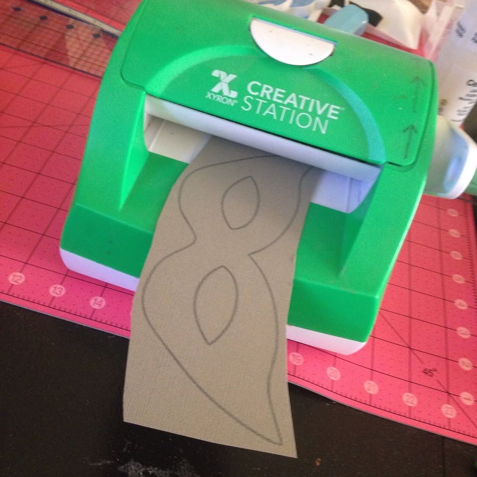 Run your mask through a Xyron Creative Station. The creative station runs a nice layer of adhesive over it. If you don't have one, you can use glue or double sided tape to attach to chipboard