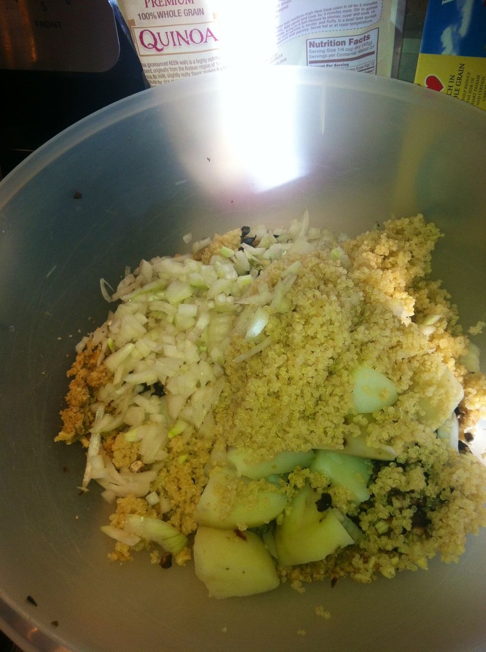 Running out of counter space so it's time to dump everything into one big bowl.  Potatoes, Quinoa, onion, garlic, walnuts, olives.