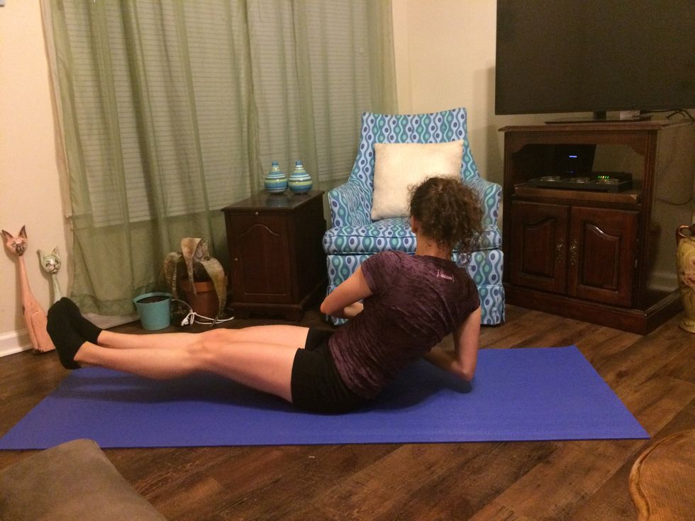 Russian Twist: Keeping your legs in the same position, turn your body to the side and touch the ball to the ground.