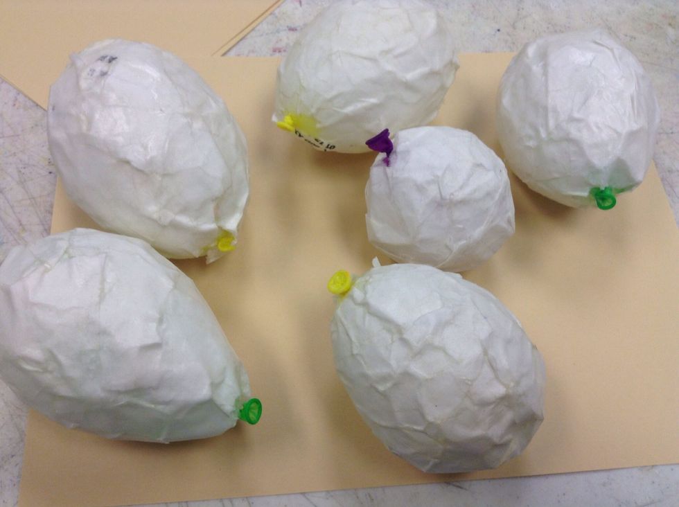 Sadly did not get pictures of the first step, guess I was too excited. Anywho, we used some watered down Mod Podge to make paper m\u00e2ch\u00e9 bodies with balloons and paper bags and let them hang overnight.