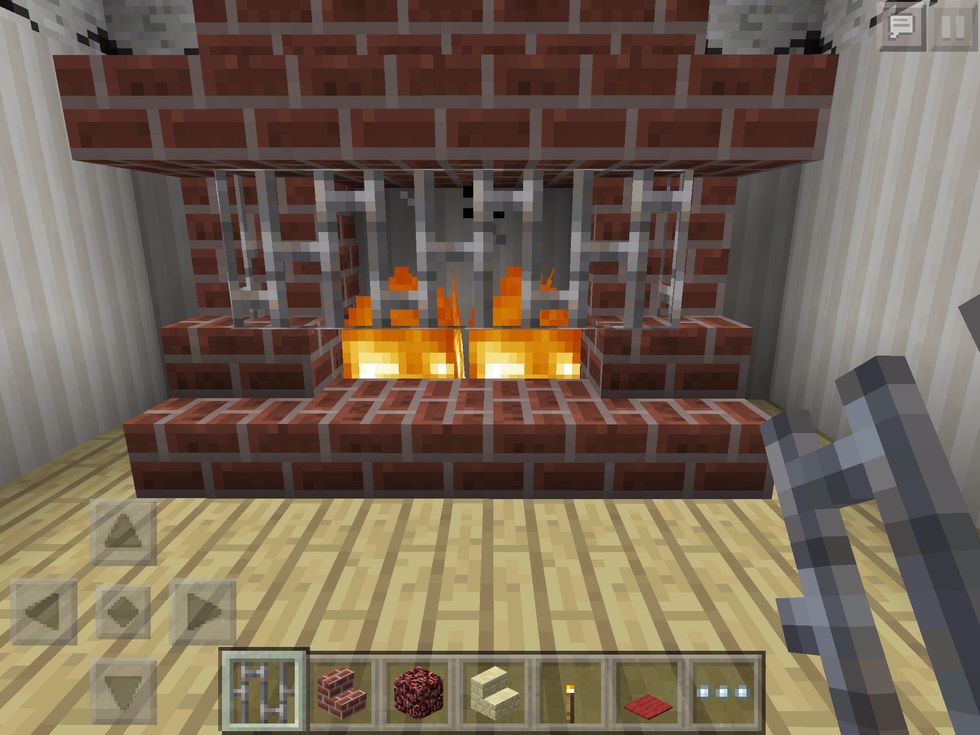 Safety first! Put up a few iron bars to stop the jumping embers burning your nice wooden floor!