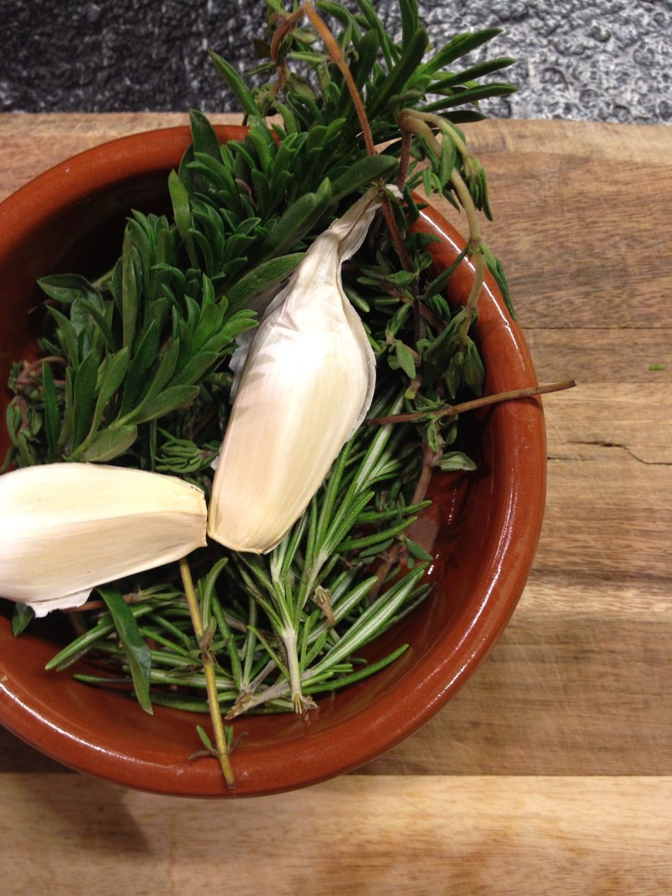 Sage, savory, thyme, rosemary and garlic. Use whatever you have available.