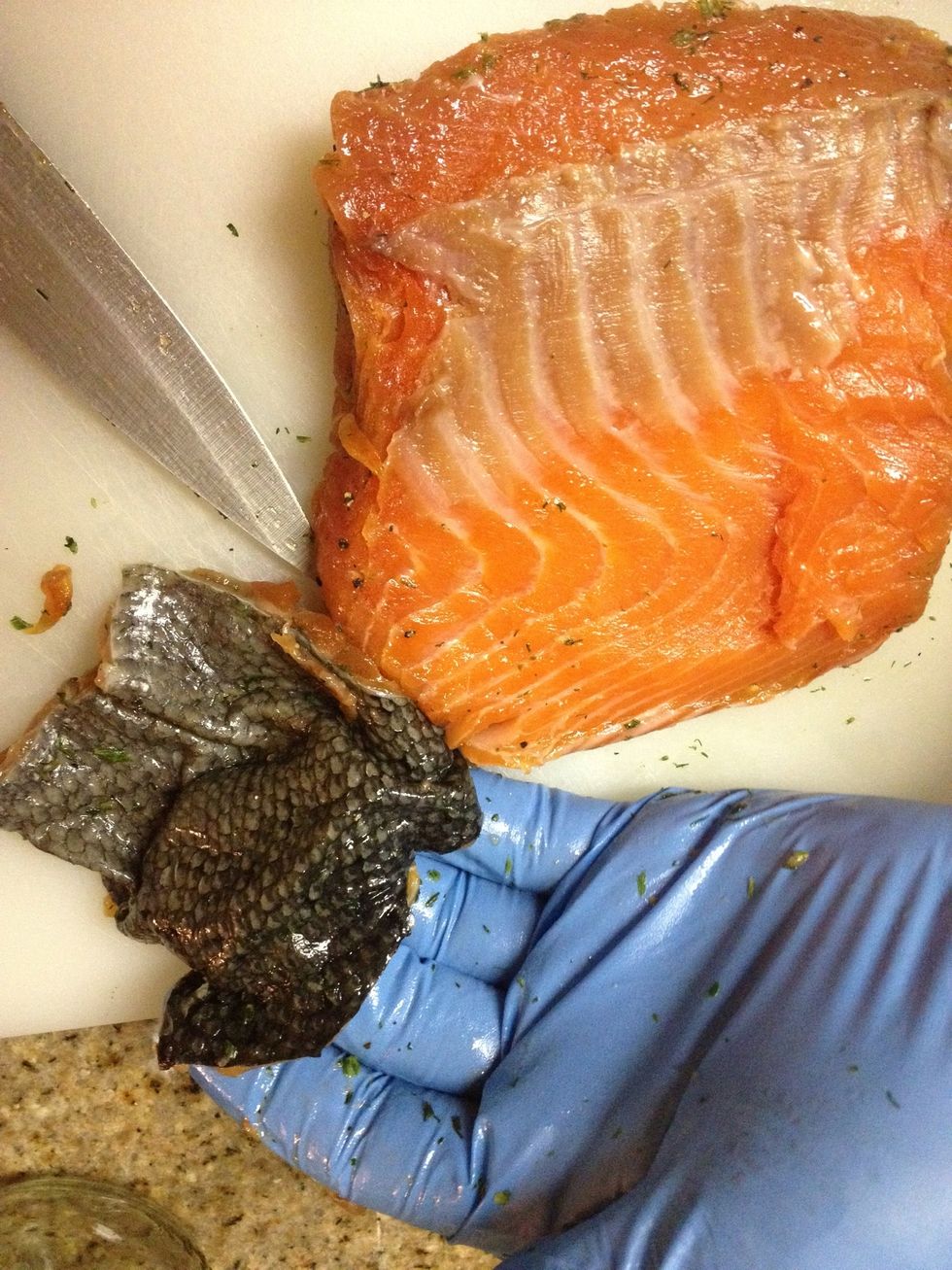 Salmon skin is the bacon of the fish world! Bonus treat: clean it up dry it off slice thin and fry in 1/2" of oil for 5-10 minutes on medium low heat stirring occasionally.