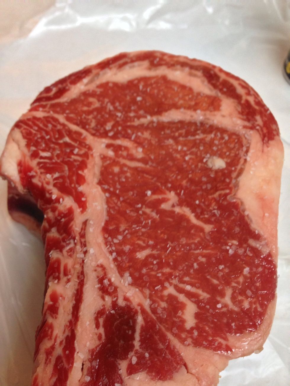 Salt both sides of the steak liberally with kosher salt. We're then going to let our steak sit from 1-2 hours, to get to room temperature and to let the salt break down enzymes. Do not re-salt.