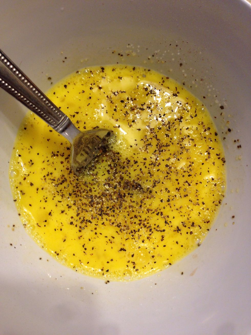 Salt & pepper two eggs & whip 'em up.