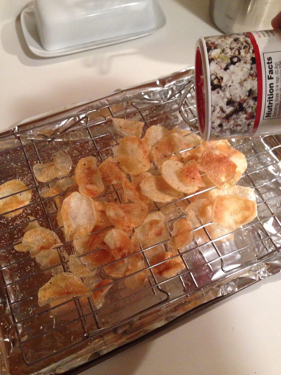 Salt your chips to your liking and let them sit while the next batch cooks. You can transfer them to a new dish before you bring the next batch to the rack.