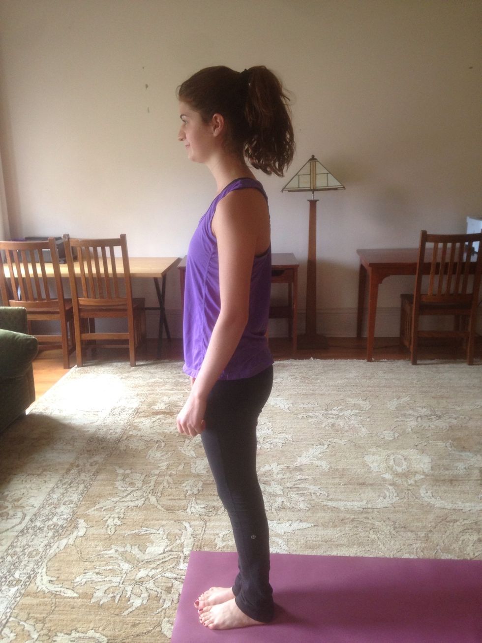 Samasthiti- the first pose of the Sun Salutations. Begin with feet together at the top of mat. Stand tall and begin to notice breath.