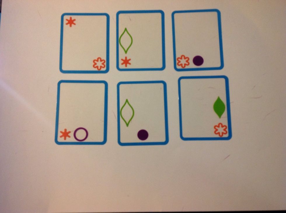 Same as step 7, but with 6 cards placed on the table. Some learners with autism will be able to start at this or later steps, but those who struggle with scanning will need to start at earlier steps.