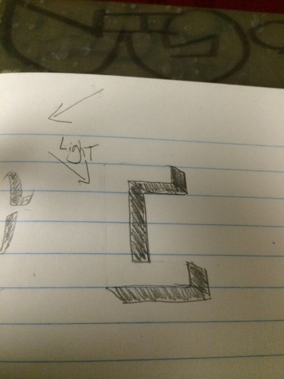 Same step as previous. Erase the part of letter that doesn't create a shadow