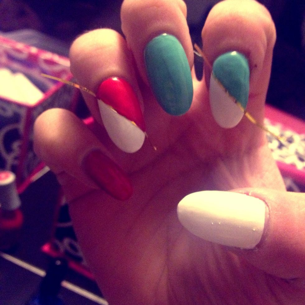 Same step with your ring finger, but paint it red.