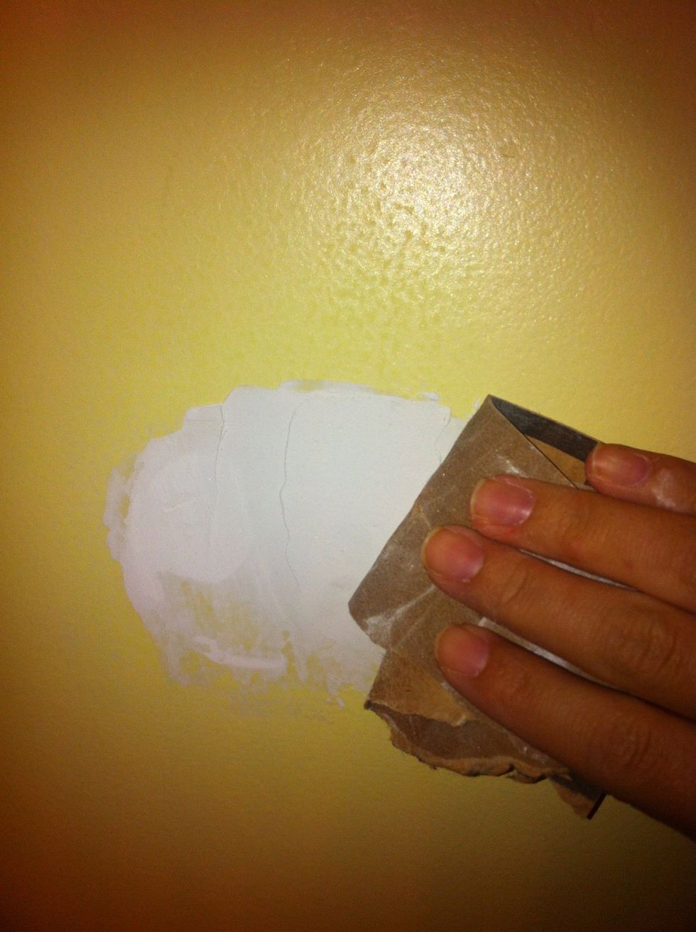 Sand down the area until its smooth