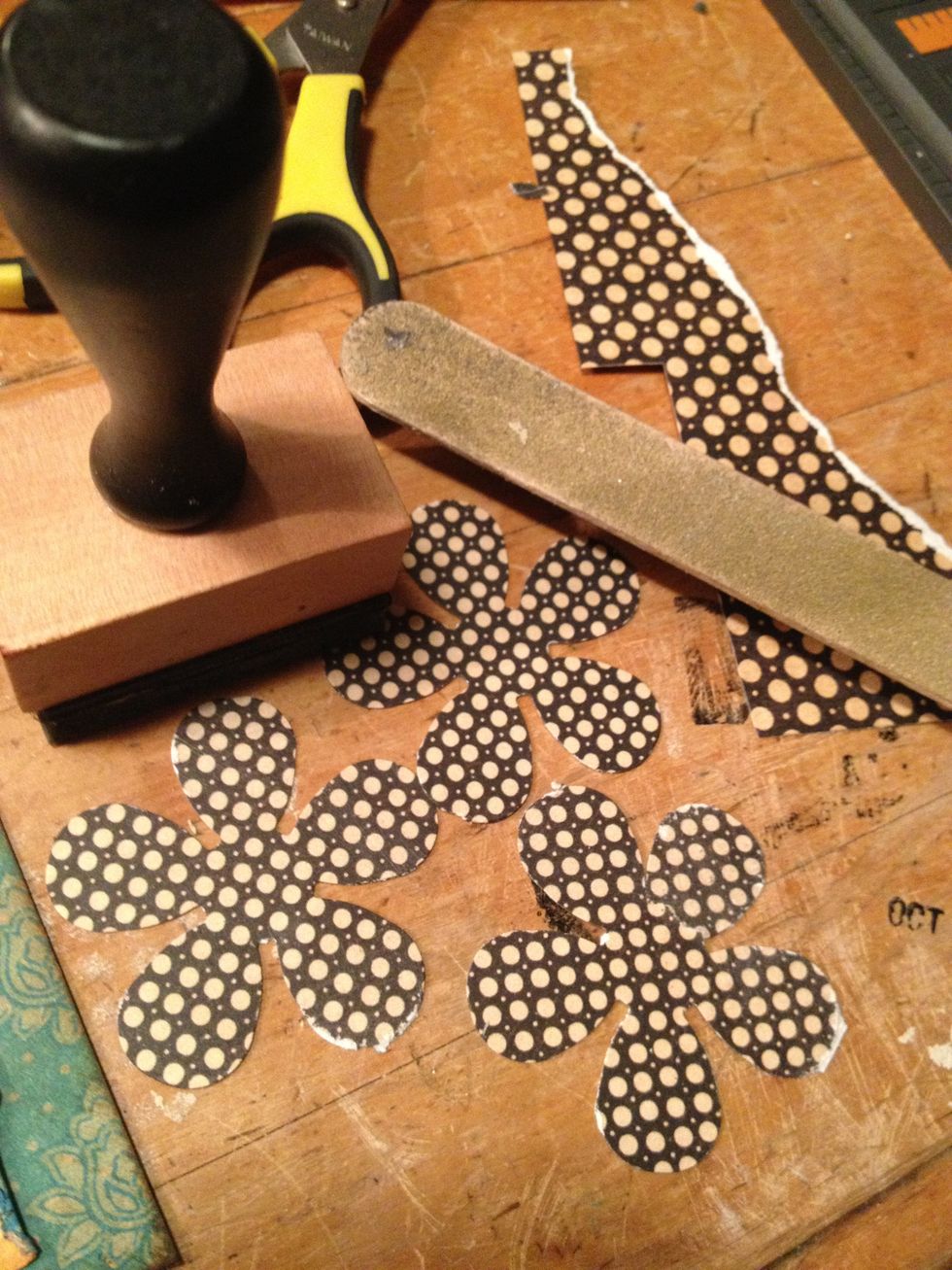 sand the edges of flowers to distress, then ink with distressing ink.