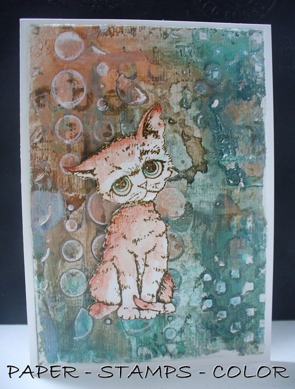 Sand the edges of the background, and the texture paste, so the stenciled texture will shows some white. Add white highlights with a white acrylic marker. Assemble the cat with 3D tape as shown. DONE!