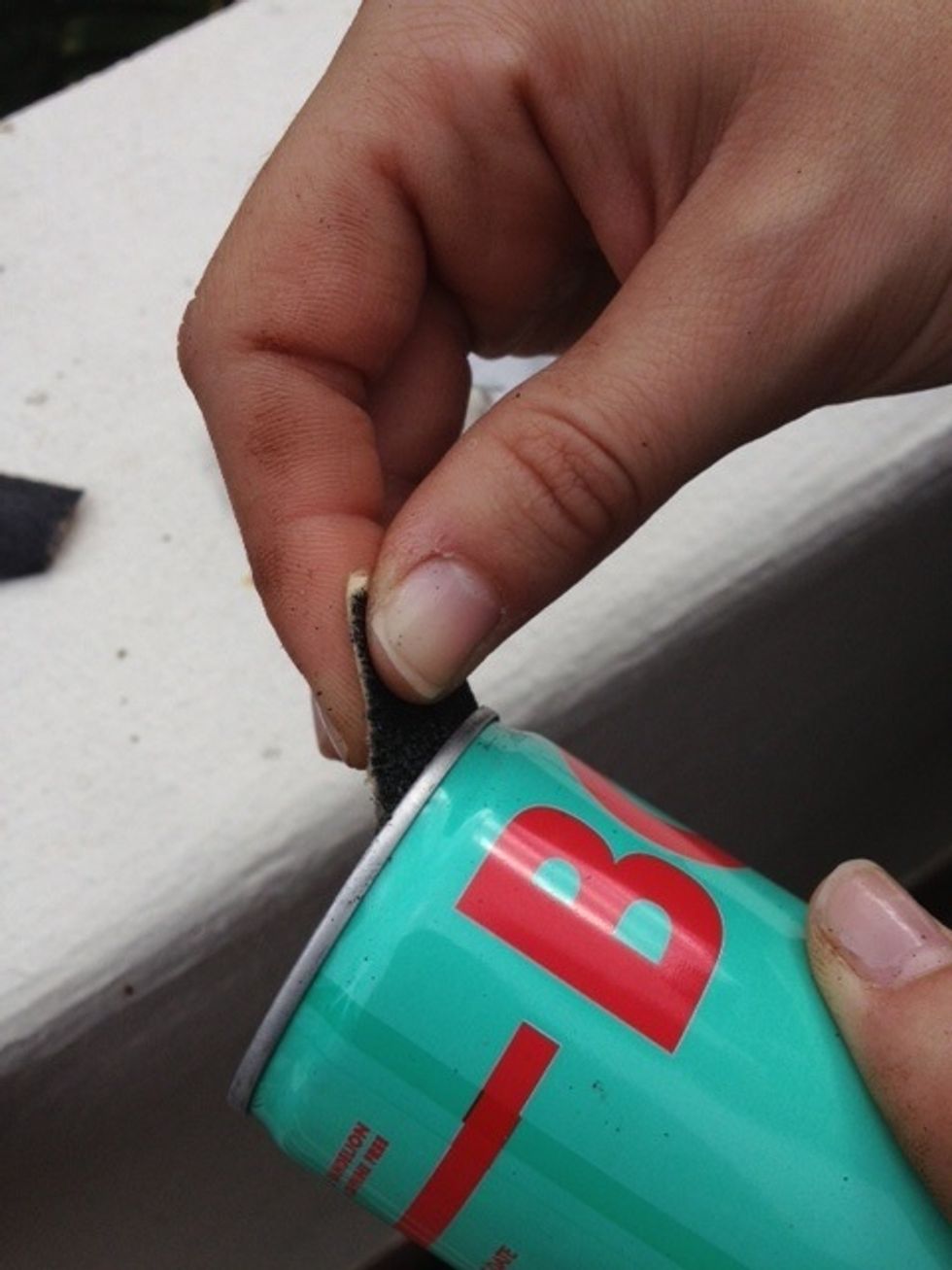 Sand the inside rim of the can for a smooth finish on the top of your planter. Poke holes in the bottom of your can for drainage. Use a drill, or a hammer and a nail.