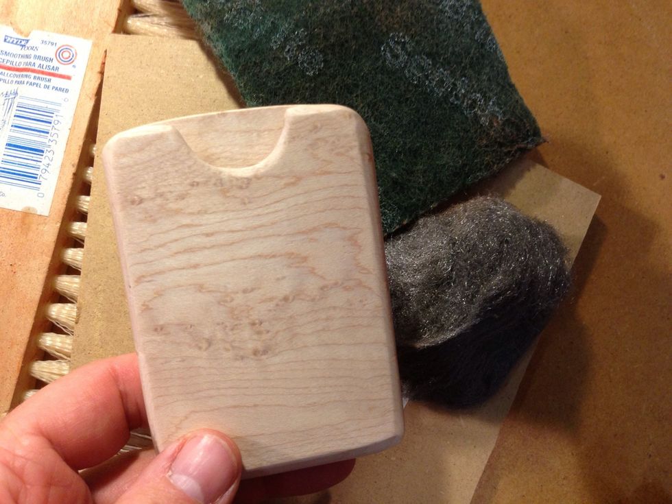 Sand with different grit papers, and finish off with steel wool to really get it smooth.