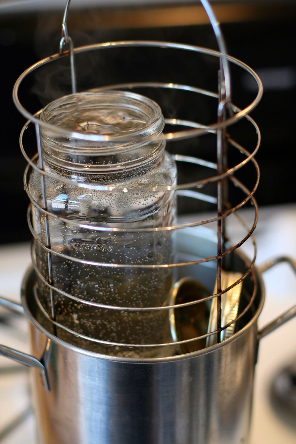 Sanitize your jars and lids by boiling them until good and hot.  The pot I use is made for boiling asparagus, works great for single jars.