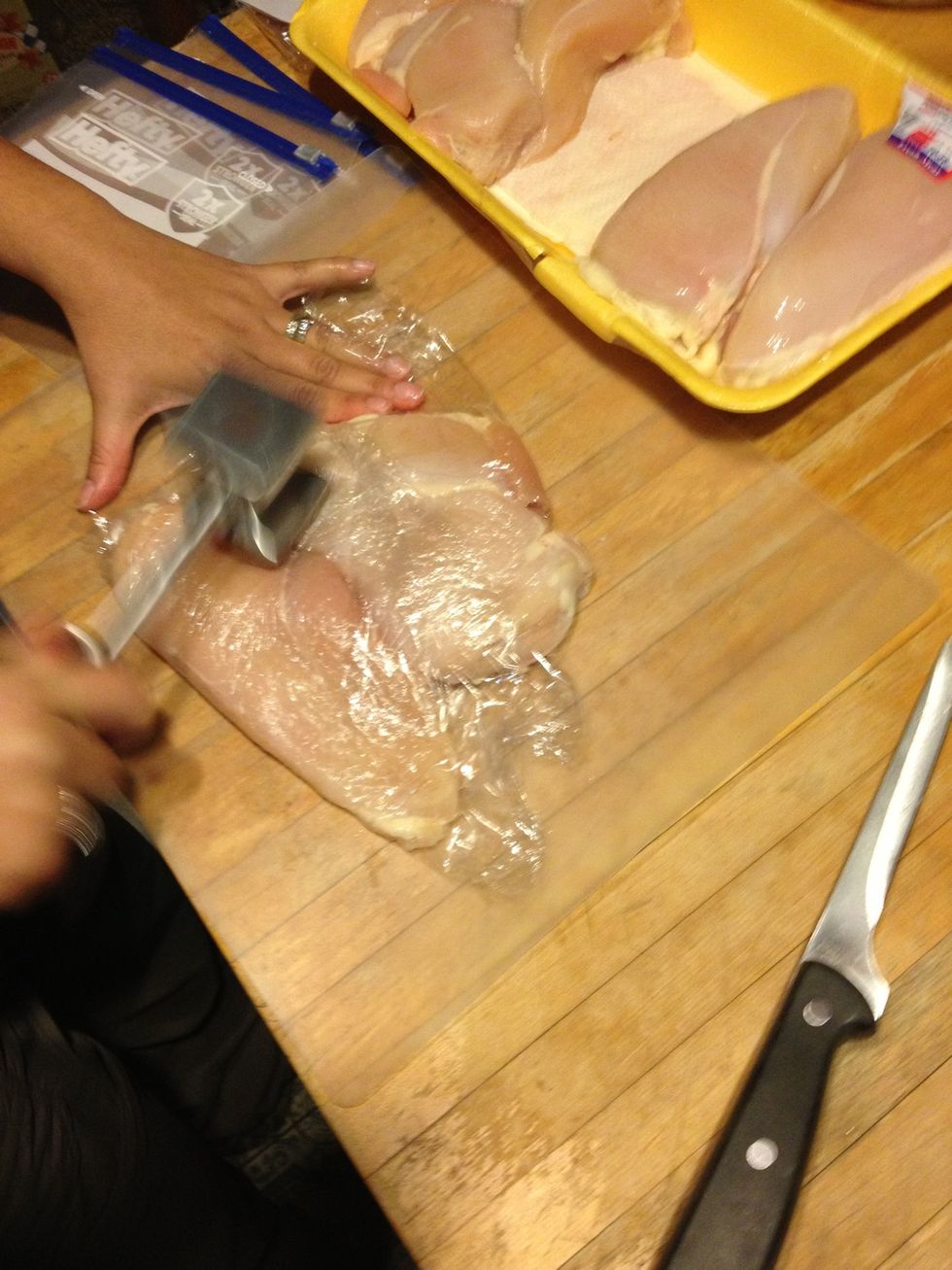 Saran wrap the chicken and beat with a mallet until flat