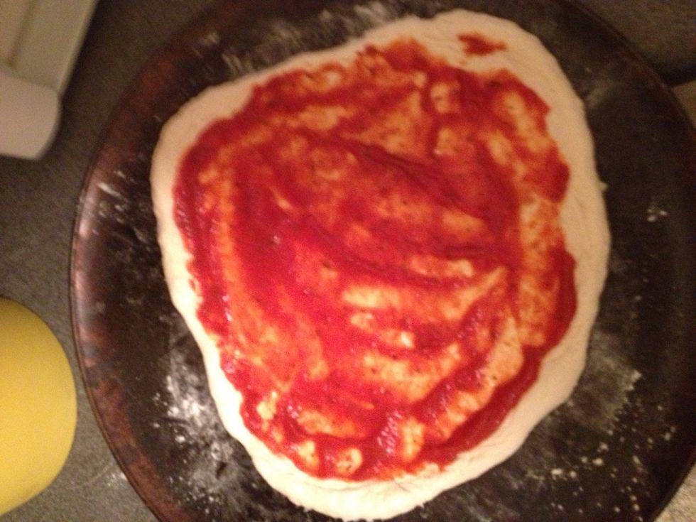 Sauce the pizza as desired