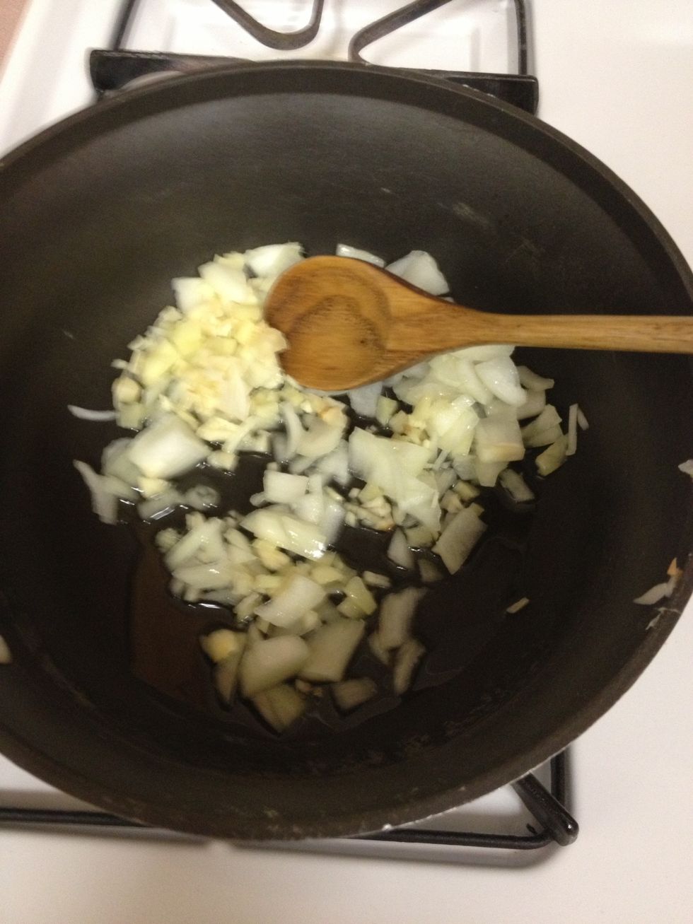 Saut\u00e9 1/2 onion, garlic, and ginger with evoo