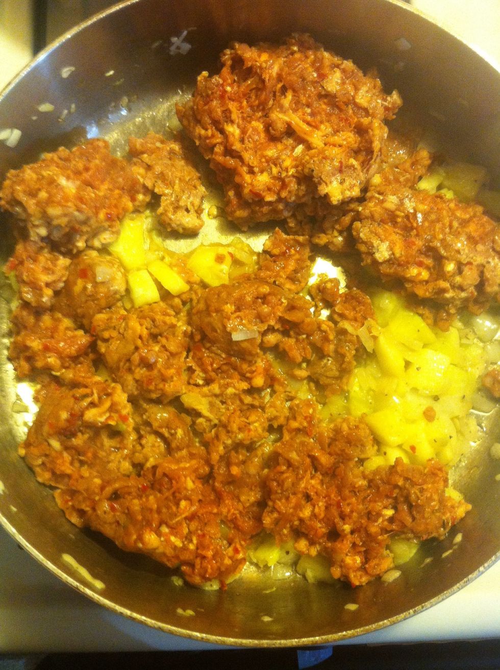 Saut\u00e9 1/4 small copped Onion, chopped yellow squash and 3 cloves chopped garlic for 3-5 mins. Add sausage and 1tsp celery seed. Brown.