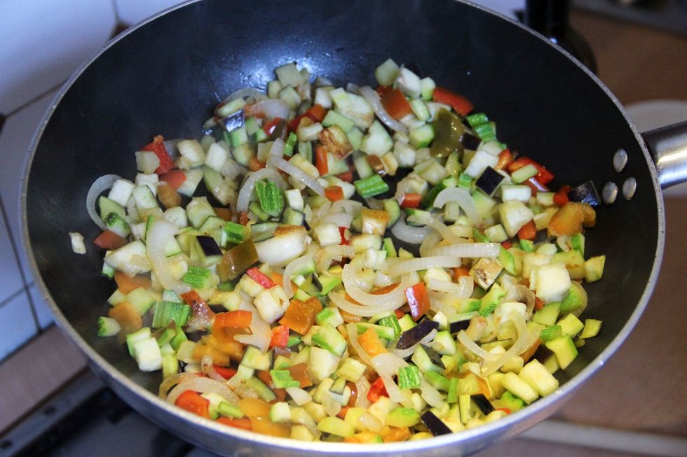 Saut\u00e9 all vegetables together until they are soft amd lightly brown