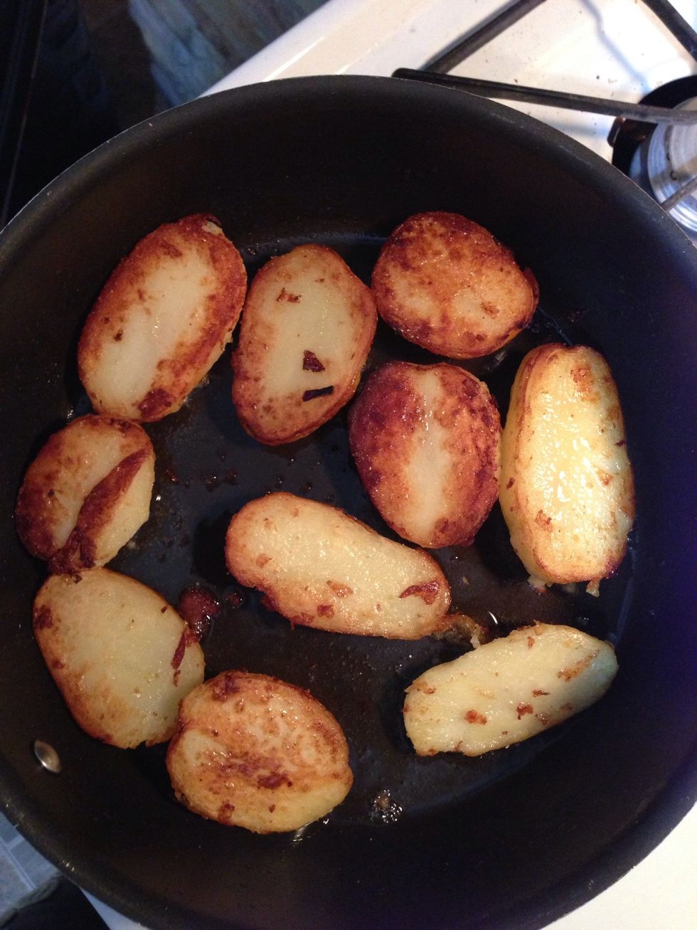 Saut\u00e9 boiled potatoes until they turn golden brown n then put them aside on a paper